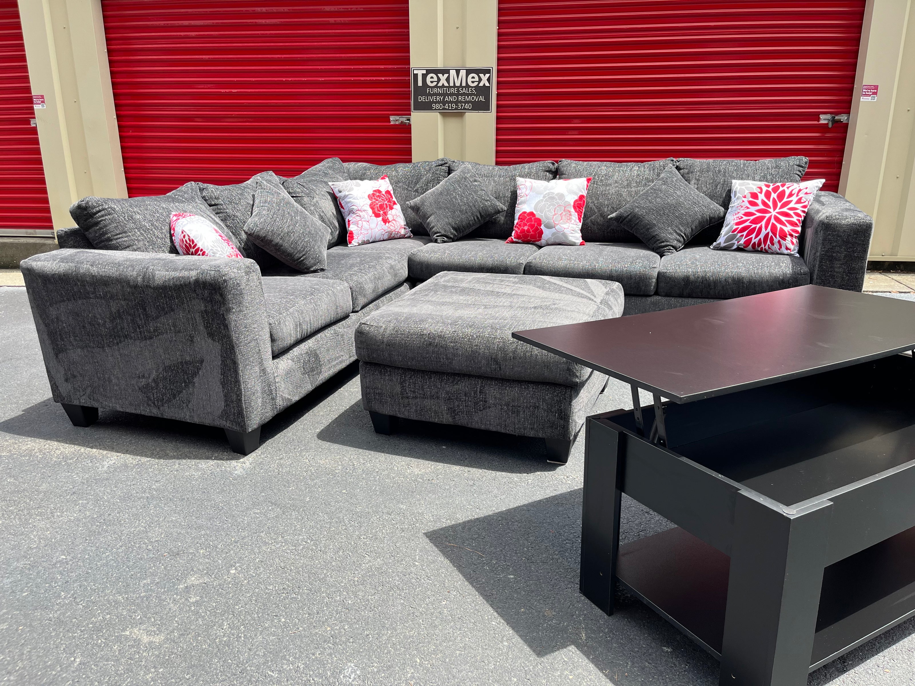 Black 3 Piece Sectional with Throw Pillows Ottoman and Table Front Left Hand Middle View