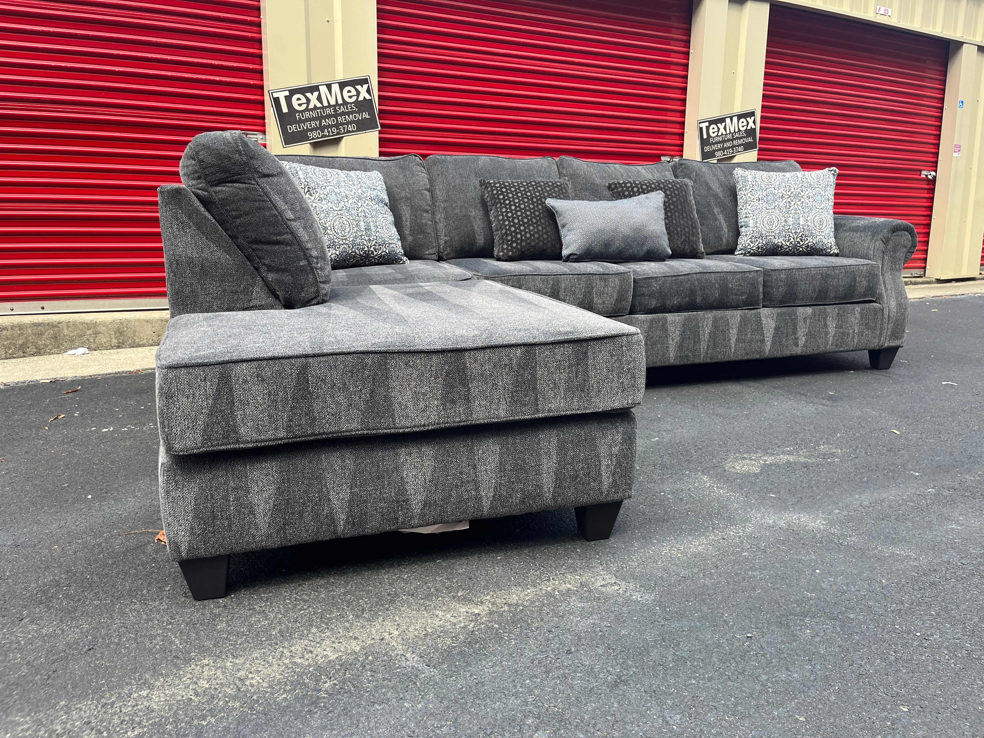 Navy Blue 2 Piece Broy Hill Sectional with Throw Pillows Partially Zoomed Front Left Hand Chaise View